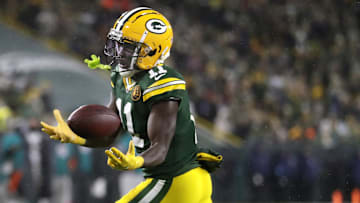 Nov 28, 2024; Green Bay, Wisconsin, USA; Green Bay Packers wide receiver Jayden Reed (11) catches a pass against the Miami Dolphins at Lambeau Field. Mandatory Credit: Wm. Glasheen-Imagn Images