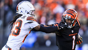 Dec 22, 2024; Cincinnati, Ohio, USA; Cincinnati Bengals wide receiver Ja'Marr Chase (1) runs with the ball against Cleveland Browns cornerback Martin Emerson Jr. (23) in the second half at Paycor Stadium. Mandatory Credit: Katie Stratman-Imagn Images