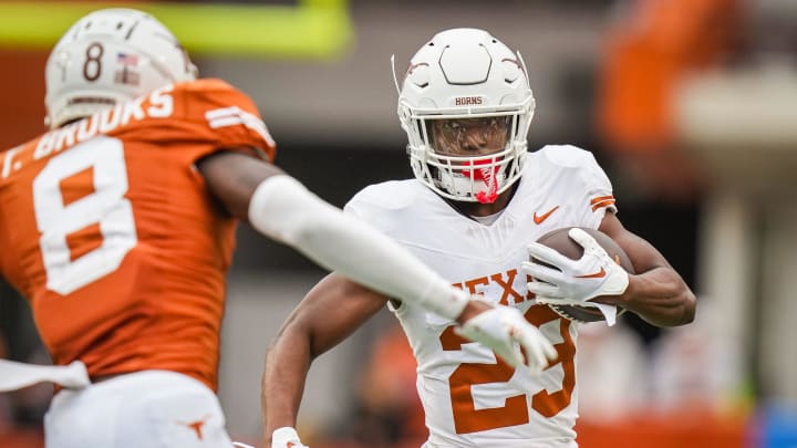 Texas White team running back Jaydon Blue (23) carries the ball.