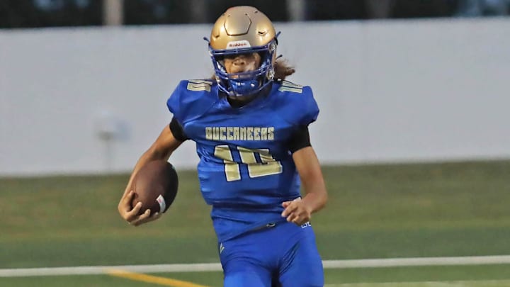 Mainland’s Sebastian Johnson (10) passed for 249 yards and six touchdowns as the Buccaneers rolled to a 53-0 victory over Seabreeze.