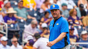 Jun 16, 2025; Omaha, Neb, USA; UCLA Bruins head coach John Savage walks off the field before the game against the LSU Tigers at Charles Schwab Field. Mandatory Credit: Dylan Widger-Imagn Images