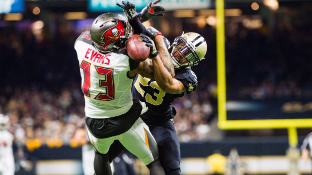 New Orleans Saints cornerback Marshon Lattimore breaks up a pass thrown to Tampa Bay Buccaneers wide receiver Mike Evans 