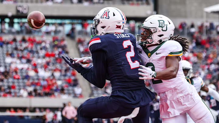 Nov 22, 2025; Tucson, Arizona, USA; Arizona Wildcats defensive back Treydan Stukes (2) intercepts the ball in the end zone during the fourth quarter of the game against the Baylor Bears at Casino Del Sol Stadium. Mandatory Credit: Aryanna Frank-Imagn Images