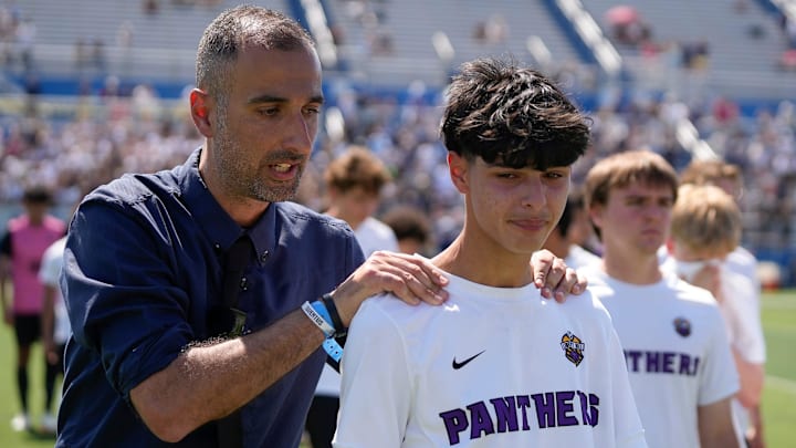 Liberty Hill head coach Stefano Salerno consoles Zayd Rasheed after losing to Dallas Highland Park at the UIL Soccer State Championships in at Birkelbach Field in Georgetown Friday April 11, 2025.