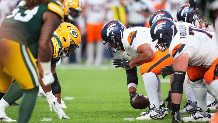 Aug 18, 2024; Denver, Colorado, USA; Denver Broncos center Sam Mustipher (61) snaps the ball in the second quarter against the Green Bay Packers at Empower Field at Mile High. 