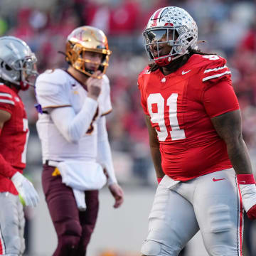 Nov 18, 2023; Columbus, Ohio, USA; Ohio State Buckeyes defensive tackle Tyleik Williams (91) celebrates a tackle during the NCAA football game against the Minnesota Golden Gophers at Ohio Stadium.