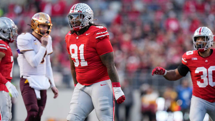 Nov 18, 2023; Columbus, Ohio, USA; Ohio State Buckeyes defensive tackle Tyleik Williams (91) celebrates a tackle during the NCAA football game against the Minnesota Golden Gophers at Ohio Stadium.