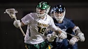 Catholic's Crawford Callahan (No. 18) presses the attack on the Gulf Breeze goal during Wednesday's rivalry match.