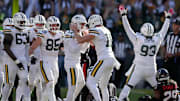 Green Bay Packers place Brandon McManus (17) and holder Daniel Whelan (19) celebrate the winning field goal against Houston.