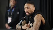 Former Milwaukee Bucks guard Damian Lillard (0) takes questions from the media during a press conference before a game against the Portland Trail Blazers at Moda Center. 