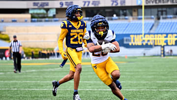 Diore Hubbard runs for a touchdown during the 2025 West Virginia Gold-Blue Spring Showcase.