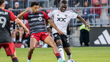 Christian Benteke #20 (R) and Brandon Servania #23 (L) in...