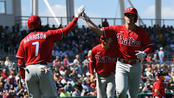 Feb 27, 2020; Fort Myers, Florida, USA; Philadelphia Phillies infielder Scott Kingery (right) is congratulated by teammate Josh Harrison (7) after hitting a two-run home run in the third inning against the Boston Red Sox at JetBlue Park. Mandatory Credit: Jim Rassol-Imagn Images
