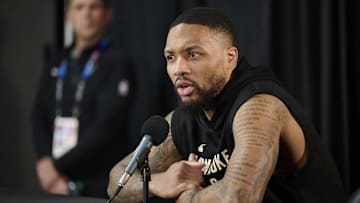 Former Milwaukee Bucks guard Damian Lillard (0) takes questions from the media during a press conference before a game against the Portland Trail Blazers at Moda Center. 