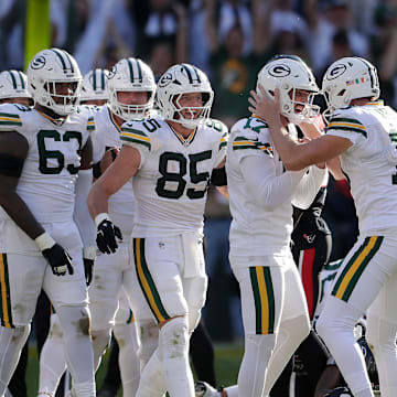 Green Bay Packers place Brandon McManus (17) and holder Daniel Whelan (19) celebrate the winning field goal against Houston.