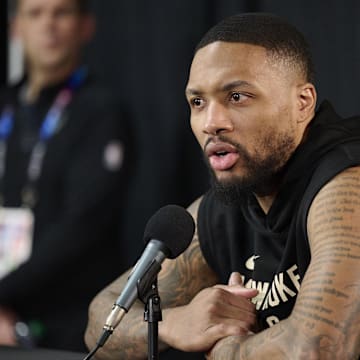Former Milwaukee Bucks guard Damian Lillard (0) takes questions from the media during a press conference before a game against the Portland Trail Blazers at Moda Center. 