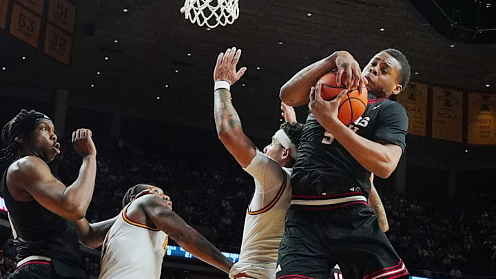 Texas Tech Red Raiders forward Josiah Moseley (5) rebounds the ball around Iowa State Cyclones guard Tamin Lipsey (3) during the second half in the Big-12 conference men’s basketball showdown on Feb. 28, 2026, at Hilton Coliseum in Ames, Iowa.