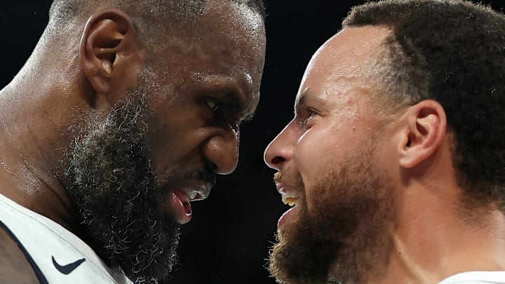 PARIS, FRANCE - AUGUST 08: LeBron James #6 and Stephen Curry #4 of Team United States celebrate after their team's win against Team Serbia during a Men's basketball semifinals match between Team United States and Team Serbia on day thirteen of the Olympic Games Paris 2024 at Bercy Arena on August 08, 2024 in Paris, France. 