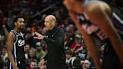 Feb 6, 2025; Portland, Oregon, USA; Sacramento Kings head coach Doug Christie talks to guard Malik Monk (0) during the first half against the Portland Trail Blazers at Moda Center. Mandatory Credit: Troy Wayrynen-Imagn Images