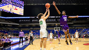 Wheatley forward Kam'Ron Hamiton leaps for a block on Kennedale's Jacks Stingley in the first half of the TX-4A Division II state championship. | Tom Dendy