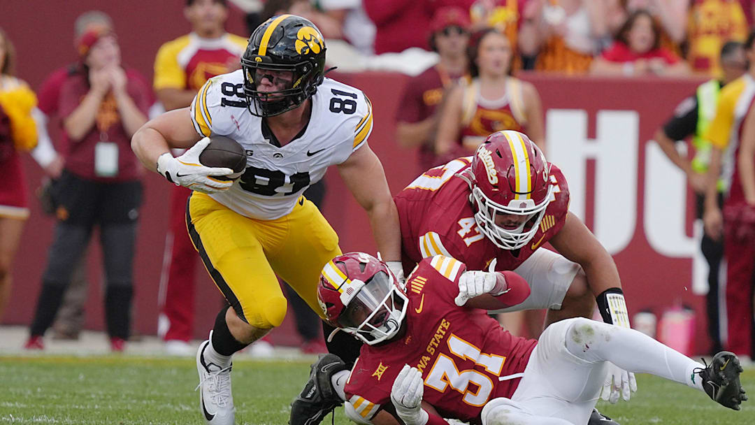 Iowa Hawkeyes tight end DJ Vonnahme (81) makes a catch around Iowa State Cyclones' defensive back Marcus Neal Jr.(31) and linebacker Kooper Ebel (47) during the fourth quarter in the Cy-Hawk football at Jack Trice Stadium on Sept. 6, 2025, in Ames, Iowa