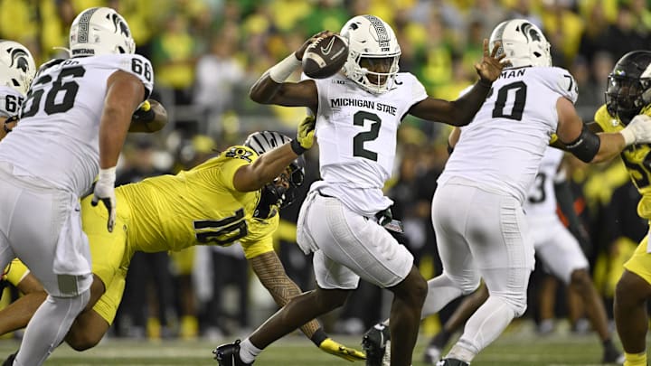 Oct 4, 2024; Eugene, Oregon, USA; Oregon Ducks defensive end Matayo Uiagalelei (10) sacks Michigan State Spartans quarterback Aidan Chiles (2) during the first half at Autzen Stadium. Mandatory Credit: Troy Wayrynen-Imagn Images