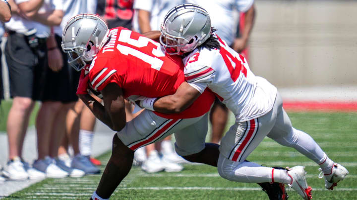 Apr 15, 2023; Columbus, Ohio, United States;  Ohio State Buckeyes tight end Jelani Thurman (15) is tackled by Ohio State Buckeyes cornerback Diante Griffin (43) during the fourth quarter of the Ohio State Buckeyes spring game at Ohio Stadium on Saturday morning. Mandatory Credit: Joseph Scheller-The Columbus Dispatch

Football Ceb Osufb Spring Game Ohio State At Ohio State