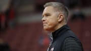 Ohio State Buckeyes head coach Chris Holtmann watches his team warm up prior to the NCAA exhibition basketball game against the Indianapolis Greyhounds at Value City Arena in Columbus on Monday, Nov. 1, 2021.