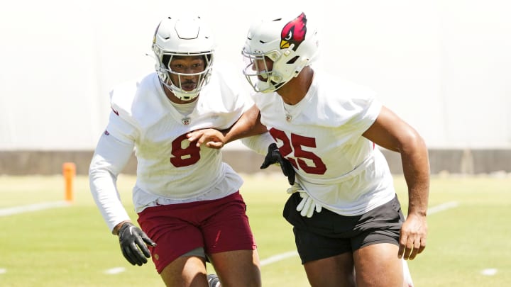 Arizona Cardinals linebackers BJ Ojulari (9) and Zaven Collins (25) during organized team activities at the Dignity Health Arizona Cardinals Training Center in Tempe on June 3, 2024.