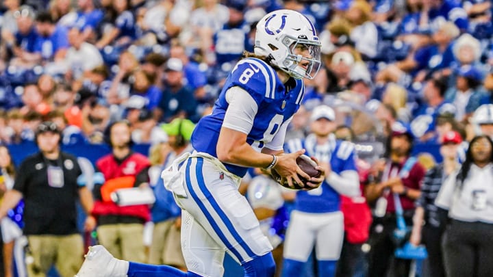 Indianapolis Colts QB Jason Bean (8) scrambles with the ball during a pre-season game between the Indianapolis Colts and the Denver Broncos on Sunday, August. 11, 2024 at Lucas Oil Stadium in Indianapolis.