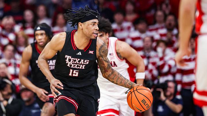 Feb 14, 2026; Tucson, Arizona, USA; Texas Tech Red Raiders forward JT Toppin (15) dribbles the ball during the first half of the game against the Arizona Wildcats at McKale Memorial Center. Mandatory Credit: Aryanna Frank-Imagn Images
