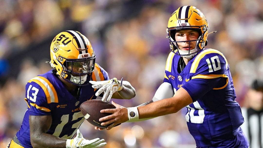 Tigers Quarterback Sam Leavitt 10 hands off to Dilin Jones 13,  LSU Tigers take on the LA Tech Bulldogs.  September 12, 2026; Baton Rouge, Louisiana, USA;  at Tiger Stadium.