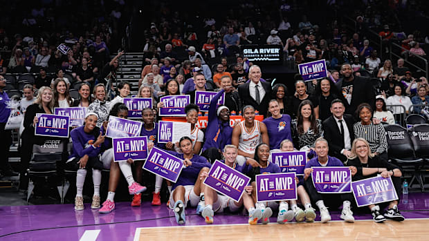 A photo of Mercury players holding up Alyssa Thomas MVP campaign sign