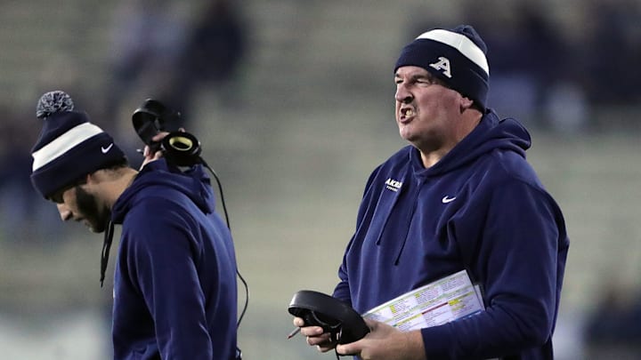 Akron coach Joe Moorhead calls a timeout against Kent State. Akron coach Joe Moorhead calls a timeout against Kent State.