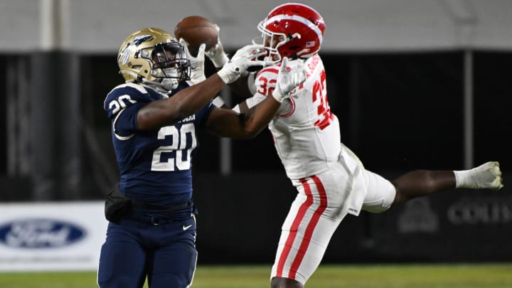 Mater Dei linebacker Abduall Sanders Jr. intercepts a pass against St. John Bosco in the 2023 CIF Southern Section Division 1 final at the LA Memorial Coliseum.