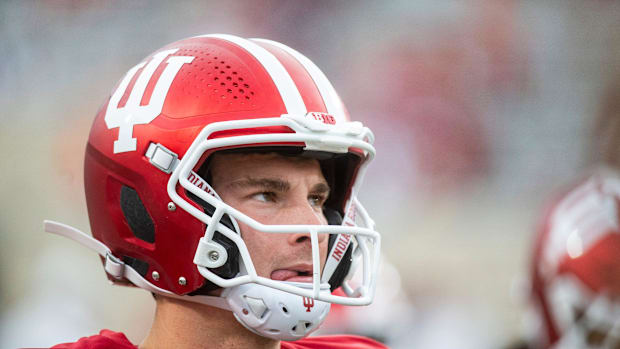 dante moore fernando mendoza oregon ducks indiana hoosiers dan lanning transfer portal quarterback nfl draft heisman big ten