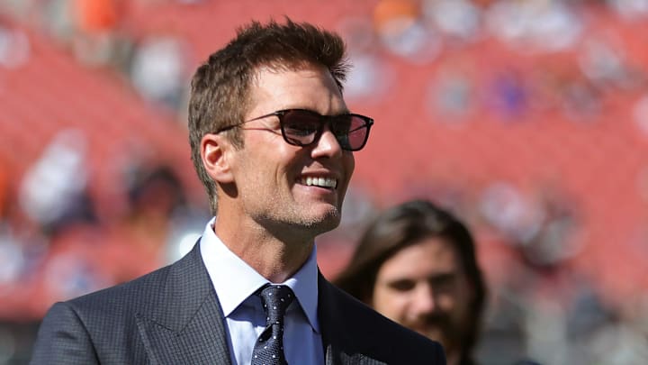 NFL legend Tom Brady is all smiles before an NFL football game at Huntington Bank Field, Sunday, Sept. 8, 2024, in Cleveland, Ohio.