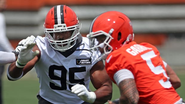 Browns defensive end Myles Garrett closes in on quarterback Dillon Gabriel during practice at minicamp, Tuesday, June 10, 202