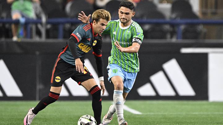 LA Galaxy midfielder Riqui Puig (10) controls the ball during the second half against Seattle Sounders FC midfielder Cristian Roldan (7) at Lumen Field