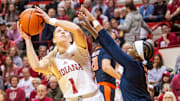 Indiana's Lexus Bargesser (1) shoots over Illinois' Genesis Bryant (1) and Kendall Bostic (44) during the Indiana versus Illinois women's basketball game at Simon Skjodt Assembly Hall on Thursday, Jan. 16, 2025.