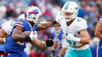 Miami Dolphins middle linebacker Kiko Alonso closes in on Buffalo Bills running back LeSean McCoy during the first quarter of a December 2016 games at New Era Field.