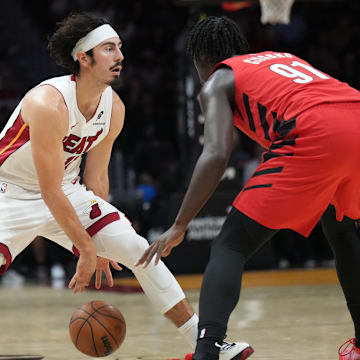 Nov 8, 2025; Miami, Florida, USA;  Miami Heat forward Jaime Jaquez Jr. (11) brings the ball up the court as Portland Trail Blazers guard Sidy Cissoko (91) defends in the first quarter at Kaseya Center. Mandatory Credit: Jim Rassol-Imagn Images