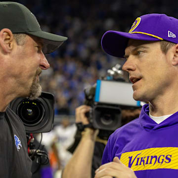 Jan 5, 2025; Detroit, Michigan, USA; Detroit Lions Head Coach Dan Campbell (L) shakes hands with Minnesota Vikings Head Coach Sean McDermott after the game at Ford Field.