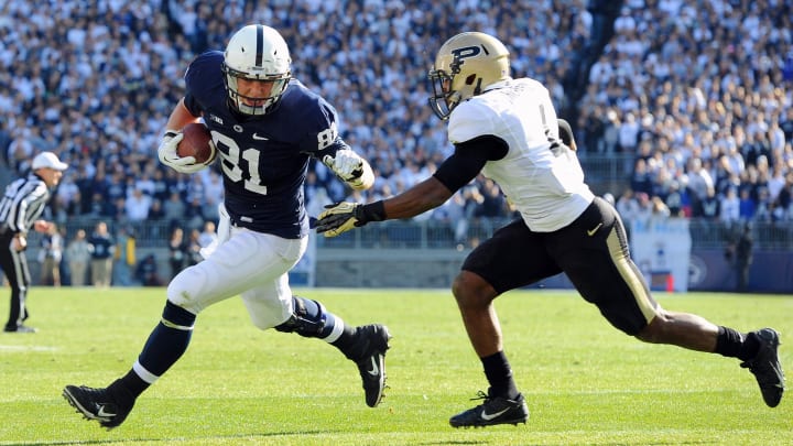 Nov 16, 2013; University Park, PA, USA; Penn State Nittany Lions tight end Adam Breneman (81) runs with the ball after a catch in front of Purdue Boilermakers safety Taylor Richards (4) during the second quarter at Beaver Stadium.  Mandatory Credit: Rich Barnes-USA TODAY Sports