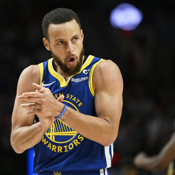 Golden State Warriors guard Stephen Curry (30) claps his hands in celebration during the second half against the Portland Trail Blazers at Moda Center. Mandatory Credit: Troy Wayrynen-USA TODAY Sports