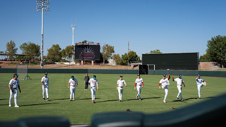 Players warm up for batting practice at Arizona Fall League media day at Scottsdale Stadium during media day on Oct. 4, 2024, in Scottsdale, Arizona.