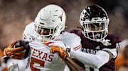 Texas Longhorns wide receiver Ryan Wingo carries the ball against Texas A&M Aggies defensive back Dezz Ricks in the second quarter of the Lone Star Showdown game at Kyle Field.