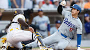Jul 31, 2024; San Diego, California, USA; San Diego Padres catcher Luis Campusano (12) tags Los Angeles Dodgers designated hitter Shohei Ohtani (17) out at the plate to end the third inning against the Los Angeles Dodgers at Petco Park. Mandatory Credit: David Frerker-Imagn Images