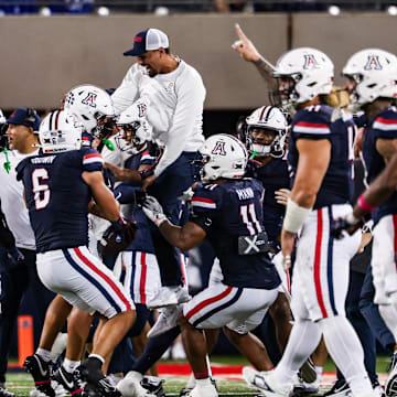 Oct 11, 2025; Tucson, Arizona, USA; Arizona Wildcats defensive back Dalton Johnson (43) celebrates an interception he caught from the Brigham Young Cougars with his team during the third quarter of the game at Arizona Stadium. Mandatory Credit: Aryanna Frank-Imagn Images