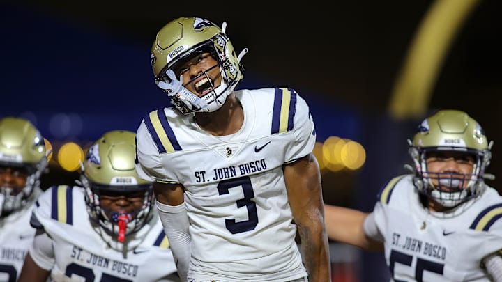St. John Bosco (Calif.) receiver Daniel Odom shows emotion while taking the field with his teammates before facing Chaminade-Madonna in the season opener in Florida. 